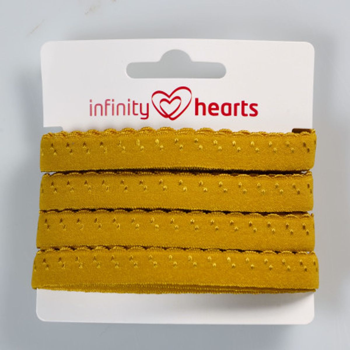 Infinity Hearts Foldeelastik Blonde 22/11mm 125C Okker - 5m